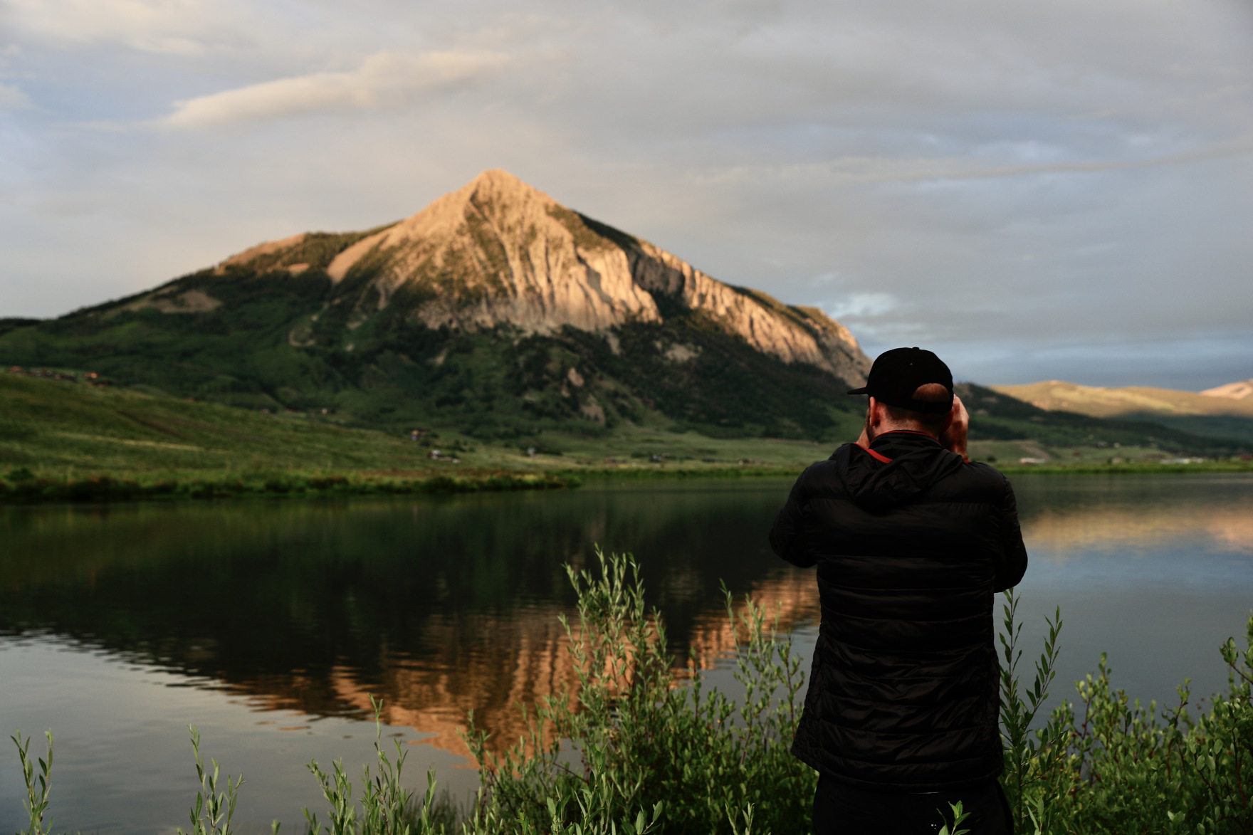 Photographer with mountain in background