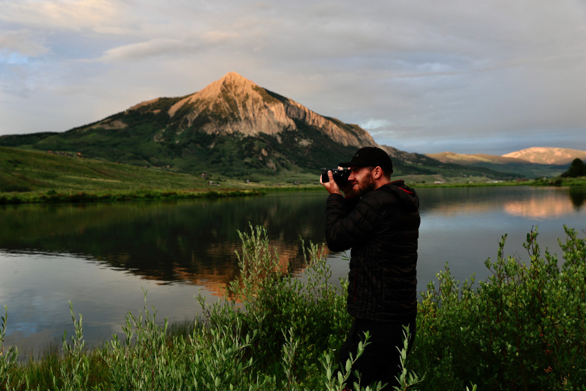 Photographer with lake in background