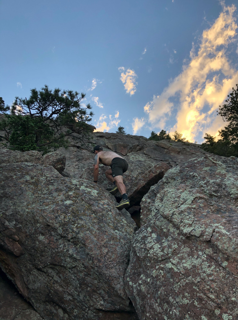 Man bouldering the side of a mountain