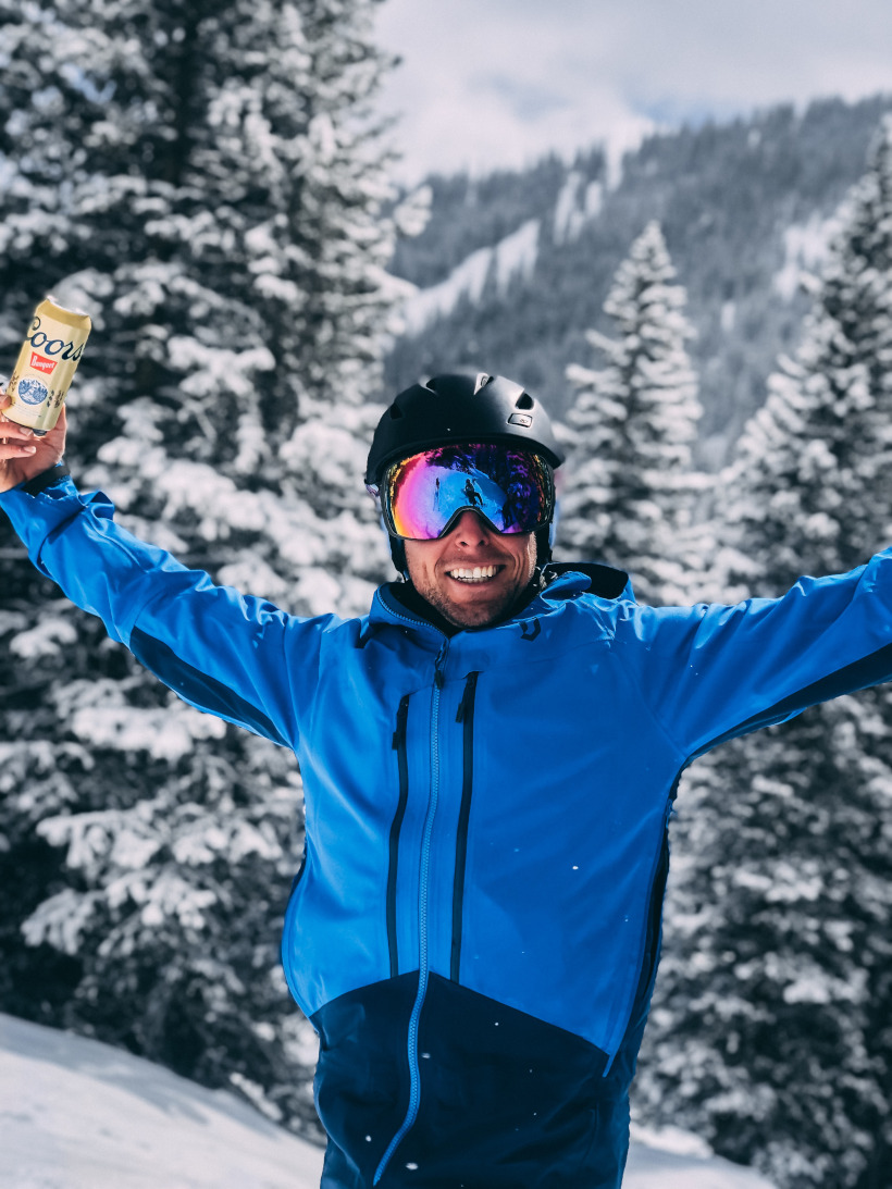 Skier with snowy mountains in background